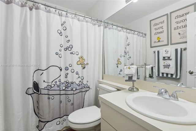 bathroom with vanity and toilet