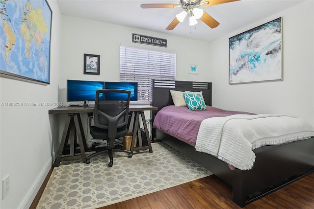 bedroom featuring hardwood / wood-style floors and ceiling fan