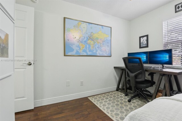 office space with dark hardwood / wood-style floors