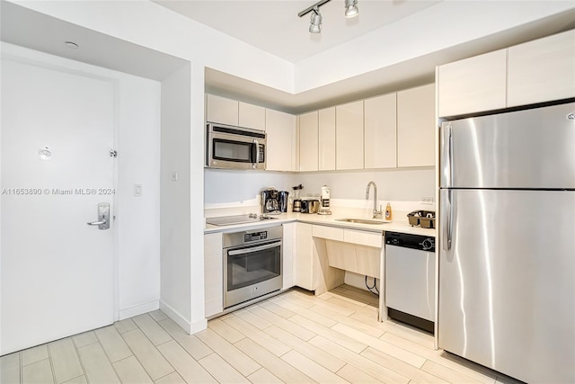 2602 E Hallandale Beach Blvd Unit R2304, Hallandale Beach, FL 33009 - kitchen with stainless steel appliances, light countertops, and a sink