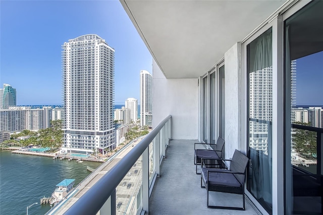 balcony featuring a water view