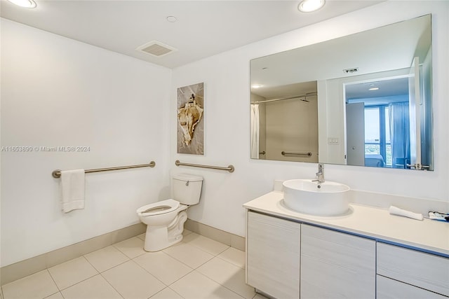 bathroom with vanity, toilet, a shower with shower curtain, and tile patterned floors