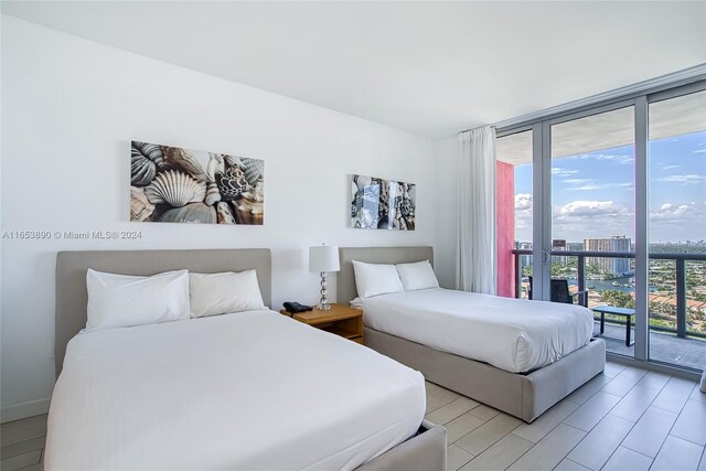 2602 E Hallandale Beach Blvd Unit R2304, Hallandale Beach, FL 33009 - bedroom featuring expansive windows, access to outside, and a city view