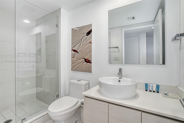 bathroom with vanity, toilet, and walk in shower