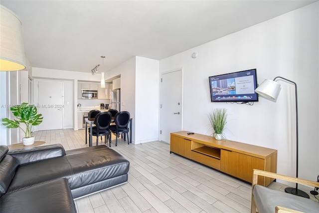 living room with light hardwood / wood-style floors