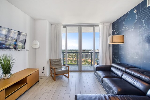 2602 E Hallandale Beach Blvd Unit R2304, Hallandale Beach, FL 33009 - living room with expansive windows and light wood finished floors
