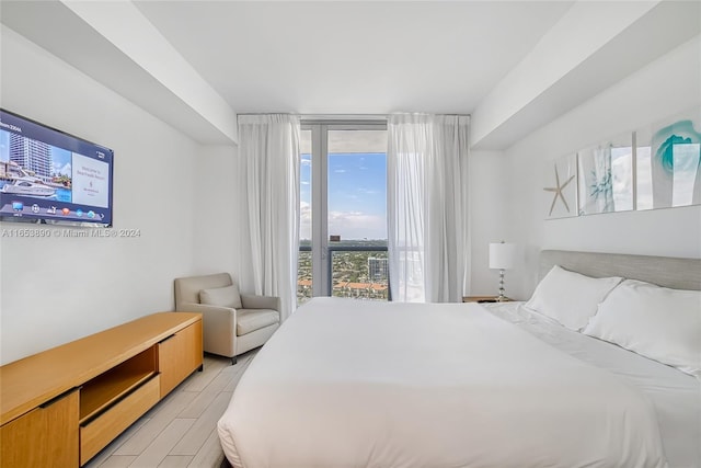 bedroom with light wood-type flooring