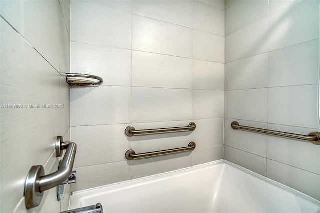 bathroom featuring separate shower and tub