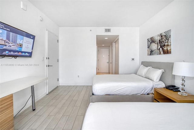 bedroom with light hardwood / wood-style flooring