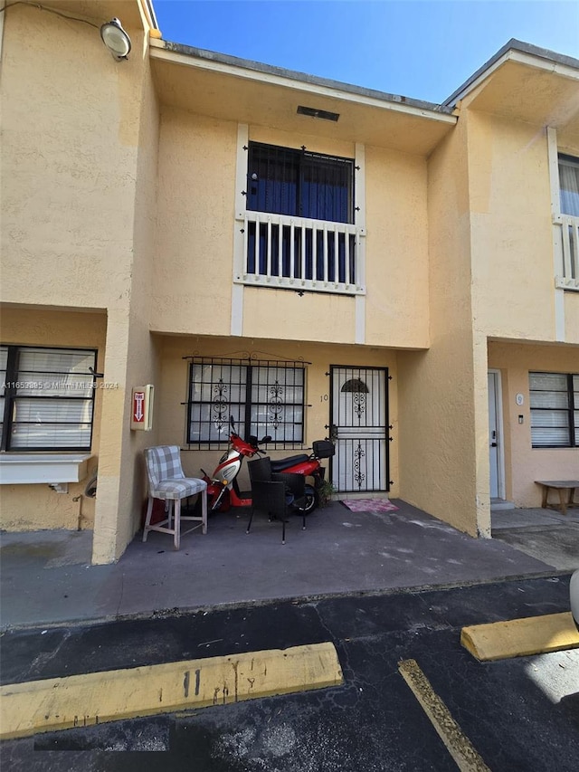 exterior space with a balcony and a patio area