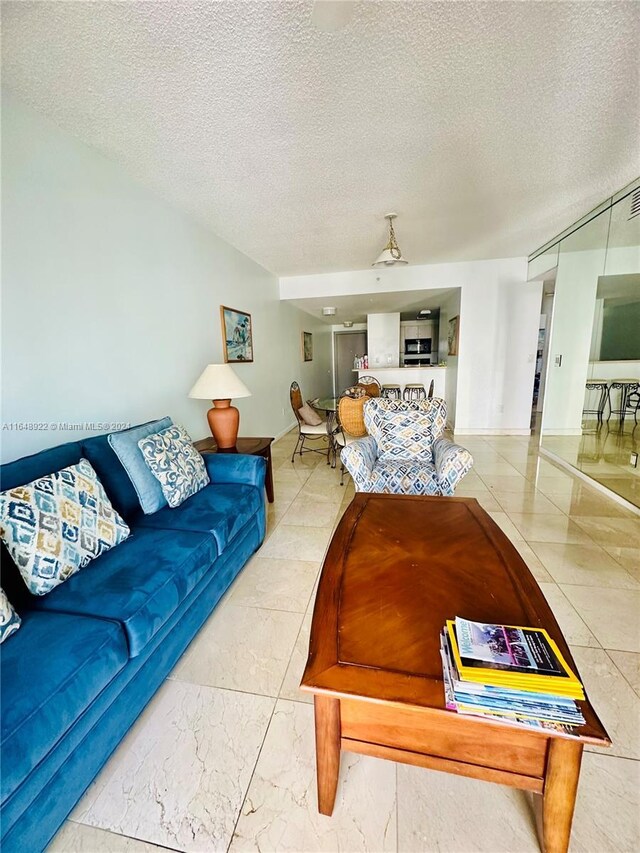 living room with a textured ceiling