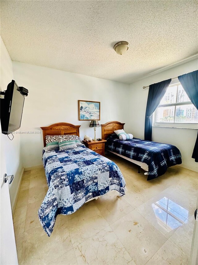 bedroom with a textured ceiling