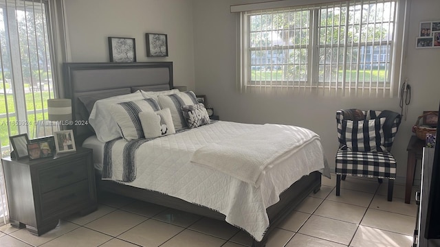 bedroom featuring light tile patterned floors