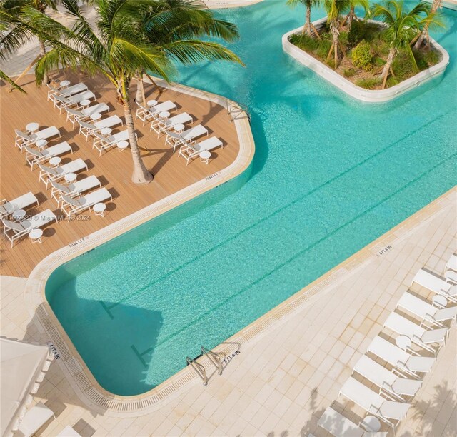 view of swimming pool featuring a wooden deck