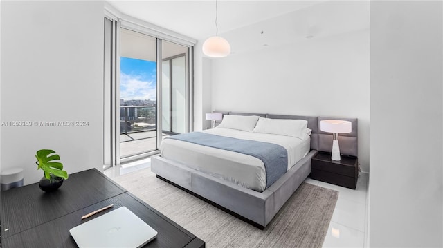 tiled bedroom featuring floor to ceiling windows and access to outside