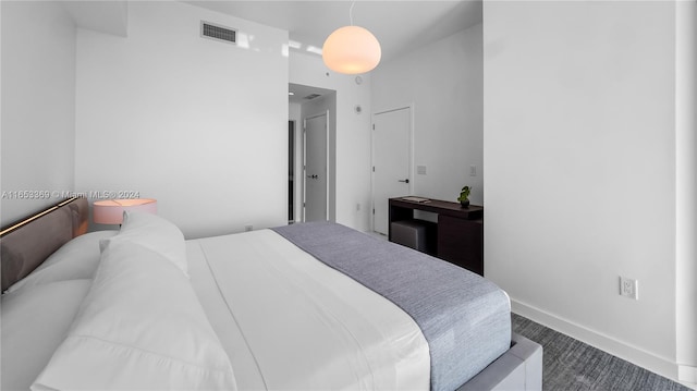 bedroom with visible vents and baseboards