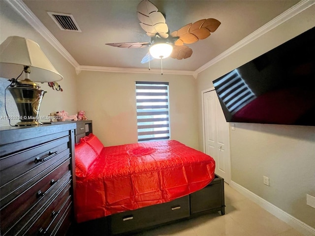 bedroom with ceiling fan and ornamental molding