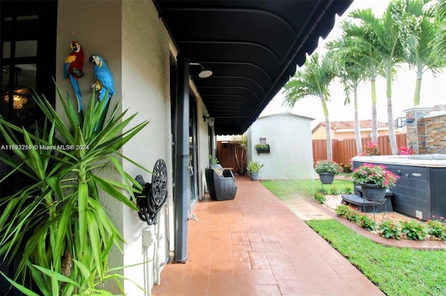 view of patio with a storage unit