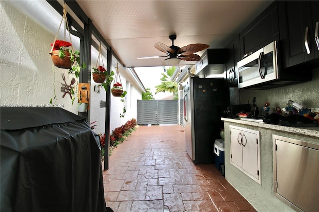 view of patio / terrace featuring ceiling fan