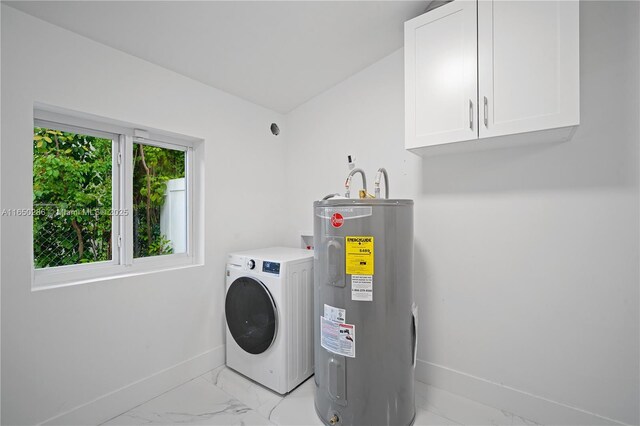 laundry area featuring cabinets, water heater, and washer / dryer