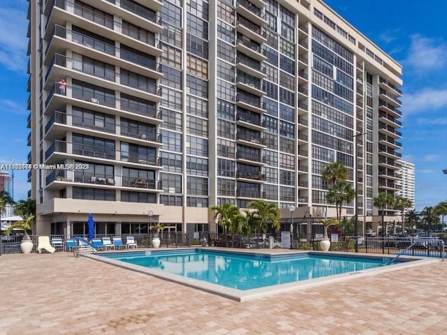 view of swimming pool with a patio