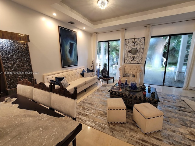 living room featuring a tray ceiling