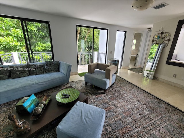 living room with tile patterned flooring