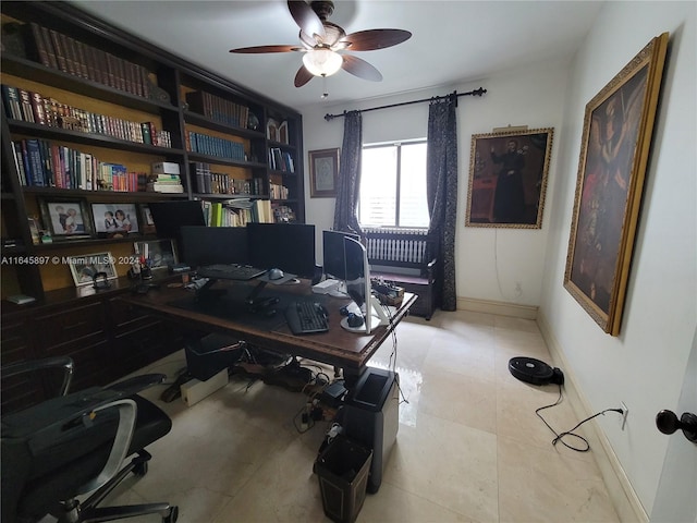 tiled office featuring ceiling fan