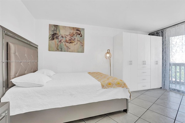 bedroom with light tile patterned floors