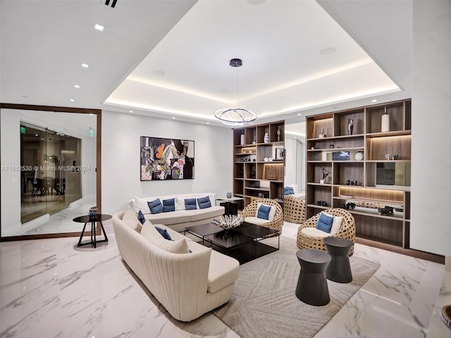 sitting room with a tray ceiling