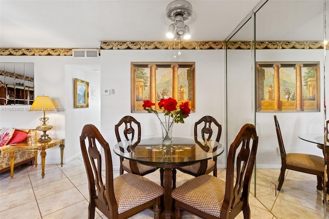 dining room featuring light tile patterned flooring and ceiling fan