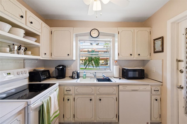 kitchen featuring white appliances, sink, and ceiling fan