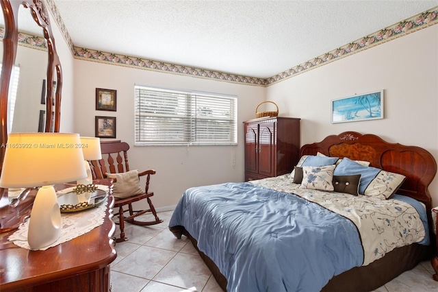 tiled bedroom with a textured ceiling