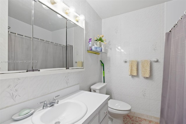 bathroom featuring vanity, tile walls, toilet, a shower with curtain, and tile patterned floors