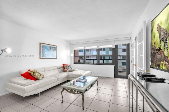 tiled living room with a textured ceiling