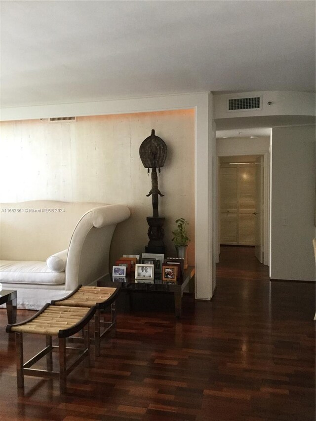 living area with dark hardwood / wood-style floors