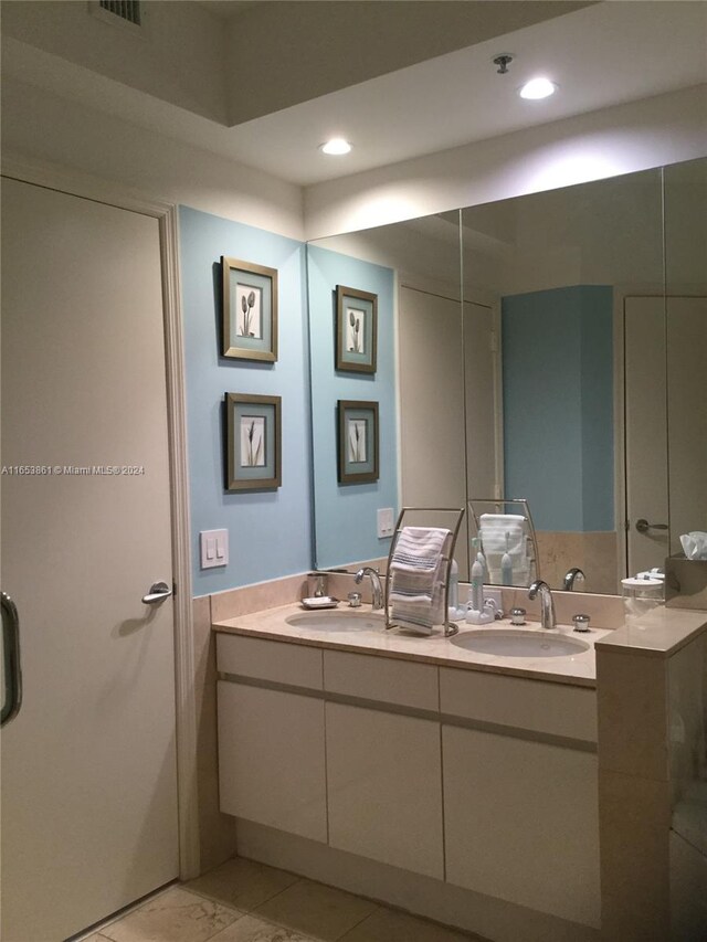 bathroom with vanity and tile patterned floors