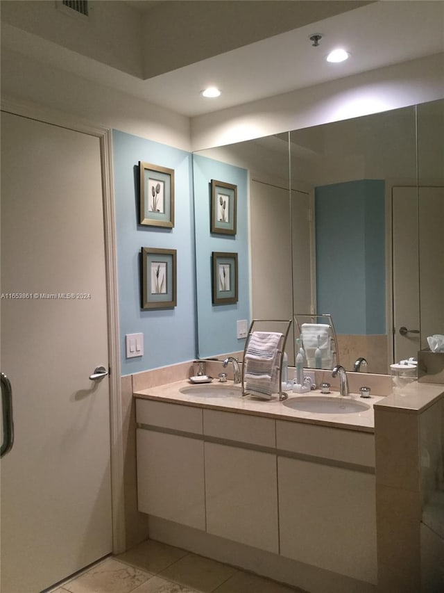 808 Brickell Key Dr Unit 2005, Miami, FL 33131 - bathroom featuring double vanity and recessed lighting