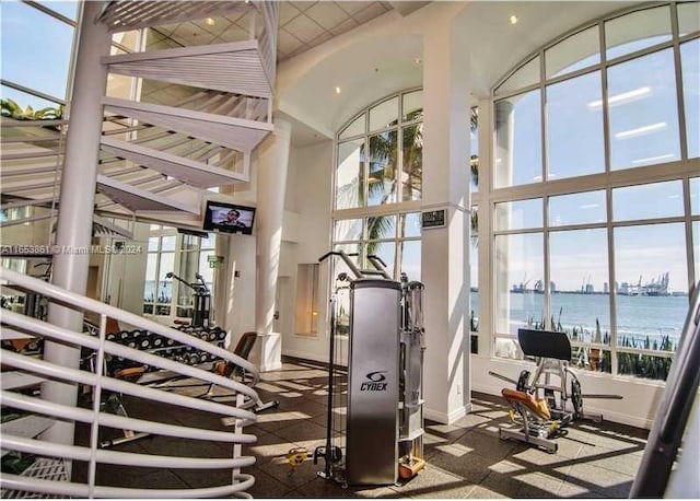 808 Brickell Key Dr Unit 2005, Miami, FL 33131 - gym featuring a high ceiling and plenty of natural light