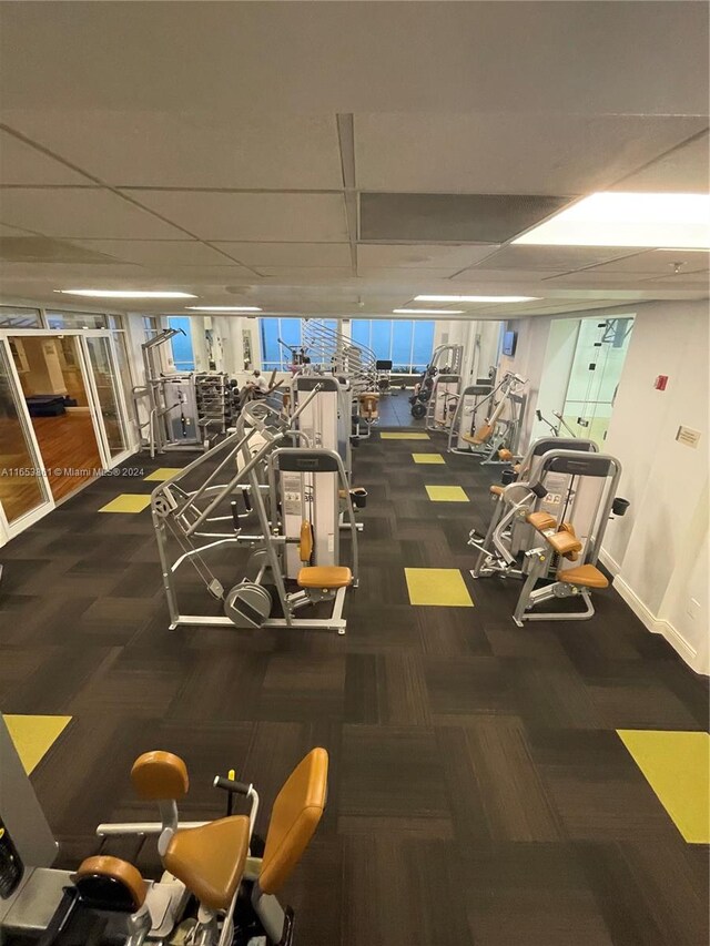 exercise room with dark carpet