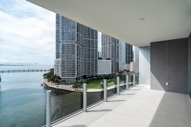 balcony featuring a water view