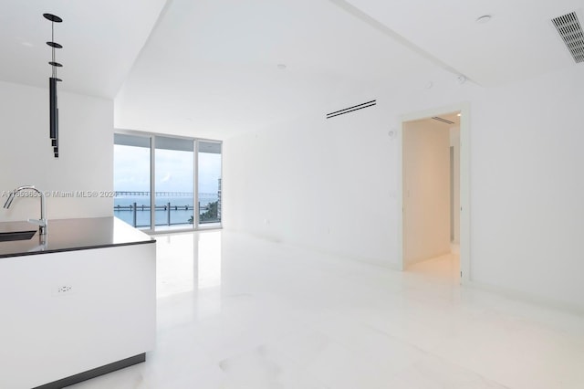300 Biscayne Blvd Way Unit 902, Miami, FL 33131 - empty room featuring floor to ceiling windows, a water view, visible vents, and a sink