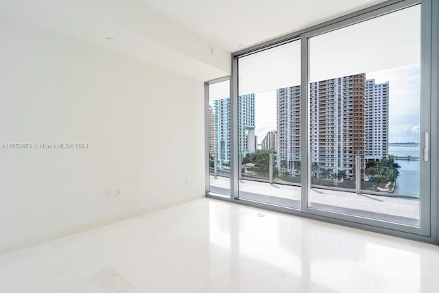 300 Biscayne Blvd Way Unit 902, Miami, FL 33131 - empty room featuring tile patterned flooring and floor to ceiling windows