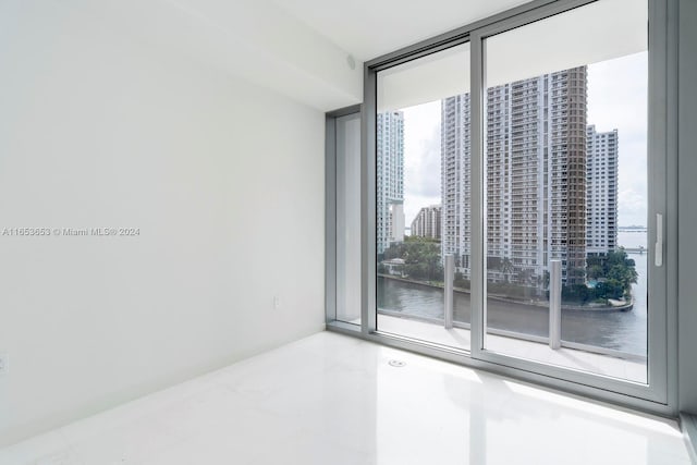 300 Biscayne Blvd Way Unit 902, Miami, FL 33131 - spare room with expansive windows and a water view