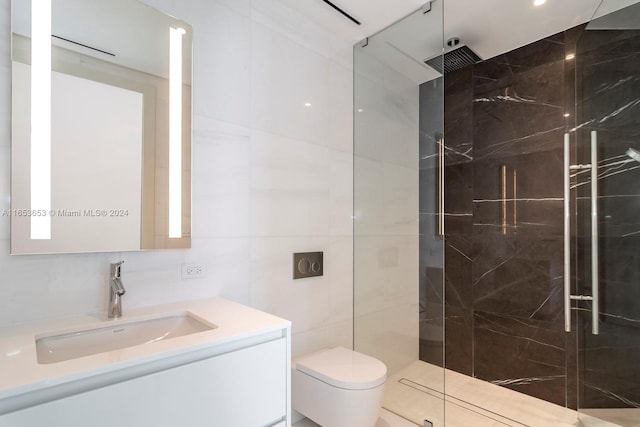 bathroom with vanity, toilet, tile walls, and a tile shower