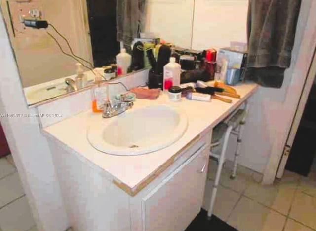 bathroom with vanity and tile patterned floors