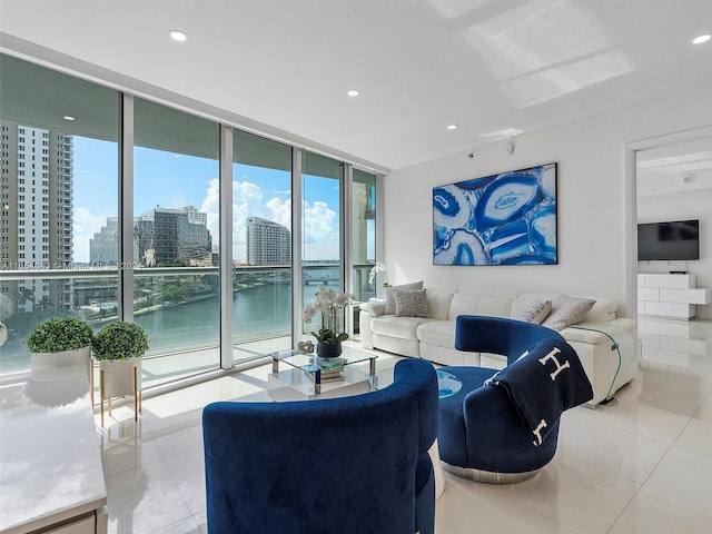 tiled living room featuring plenty of natural light and expansive windows