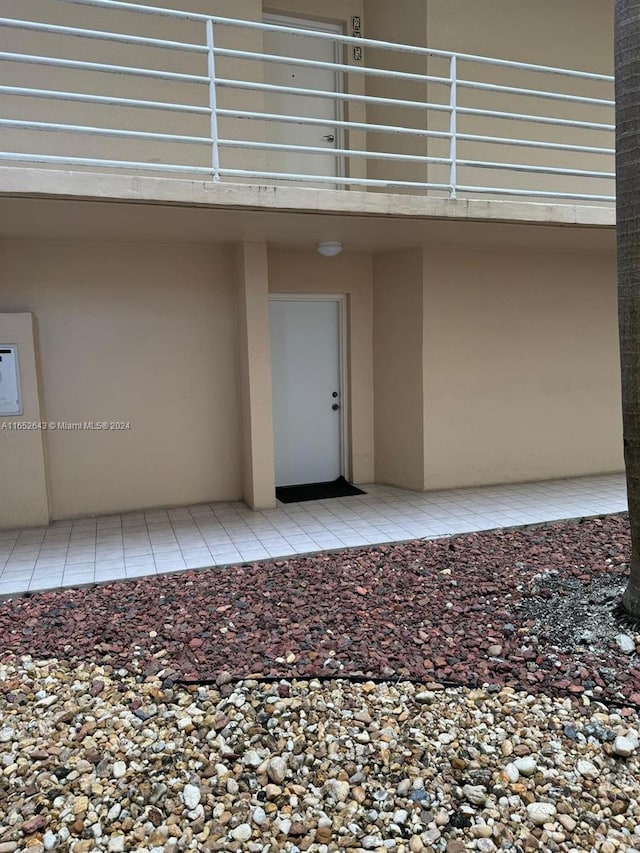 doorway to property featuring a balcony