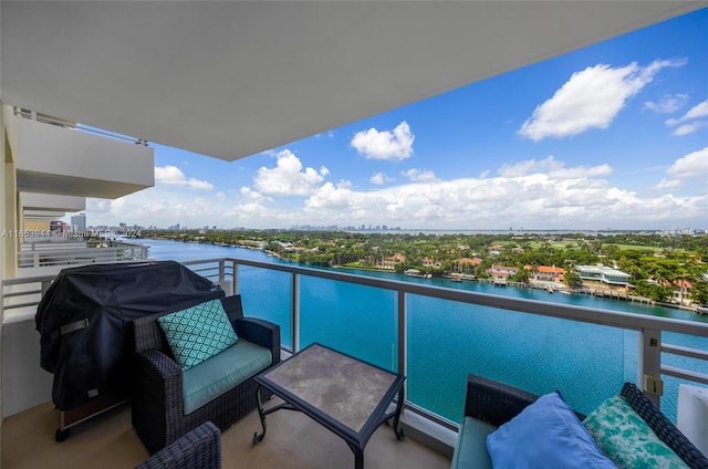 balcony featuring a grill and a water view