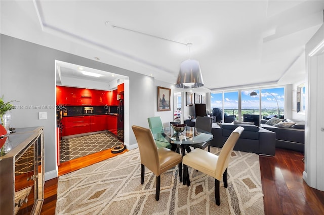 dining area with dark hardwood / wood-style floors